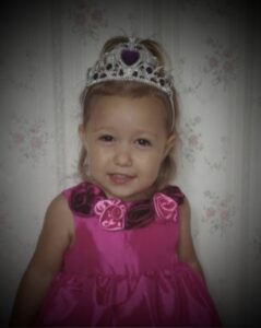 Little girl wearing a crown, symbolizing identity as a Daughter of the King