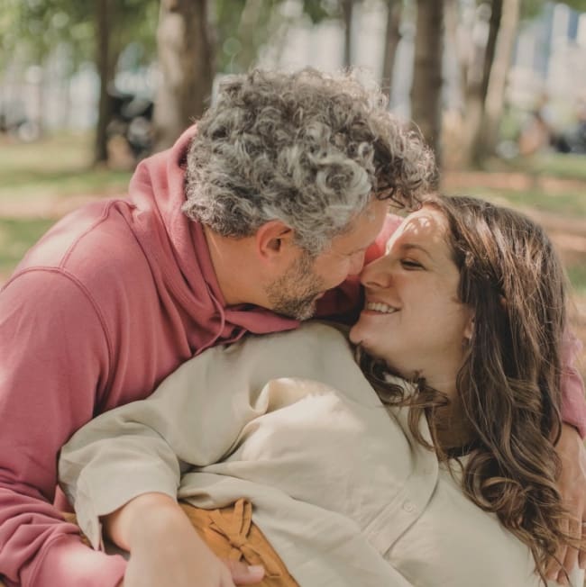 Couple embracing closely outdoors, representing arKardia's Custom Consultative Suite, an alternative to couples therapy for relationship guidance.