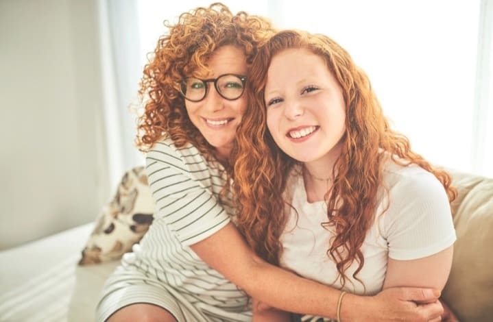 Mother and daughter embracing, representing the relational healing addressed through arKardia's integrative trauma therapy approach.